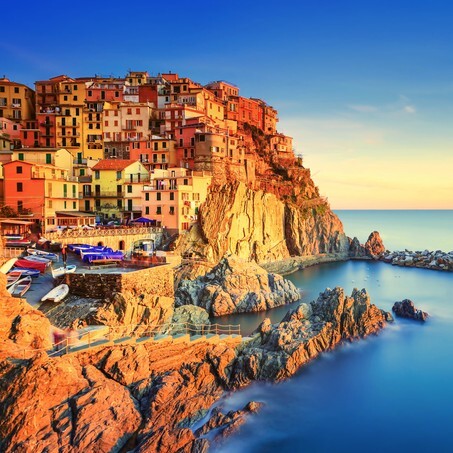 Manarola village on cliff rocks and sea at sunset., Seascape in Five lands, Cinque Terre National Park, Liguria Italy Europe